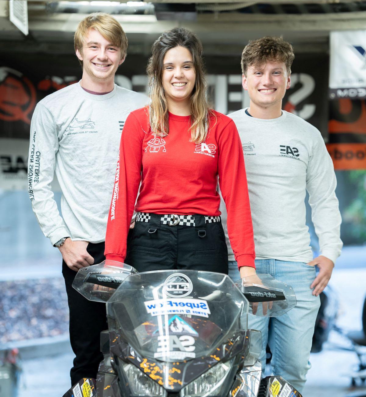 University of Idaho student McKenzie Reid with fellow students and snow mobile